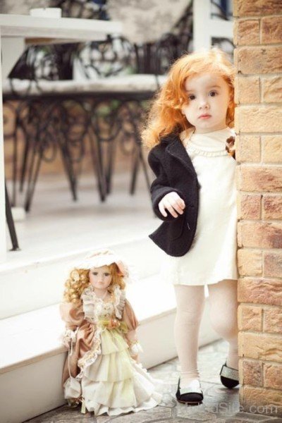 Cute Baby Boy With Doll