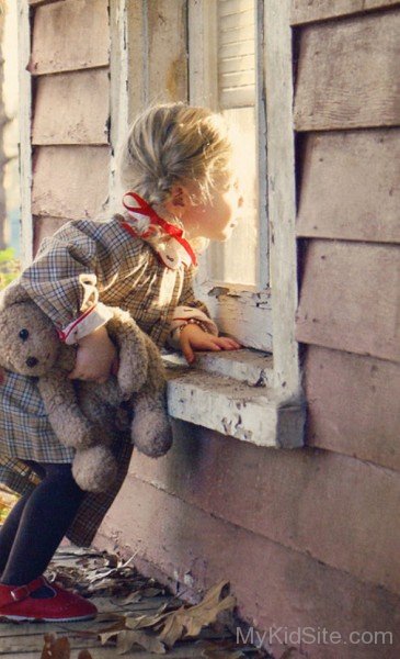 Cute Baby Girl Holding Teddy