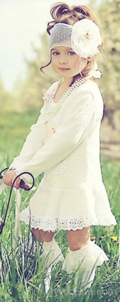 Cute Baby Girl Wearing Cream Frock