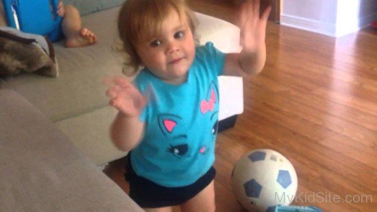 Cute Baby Playing With Football