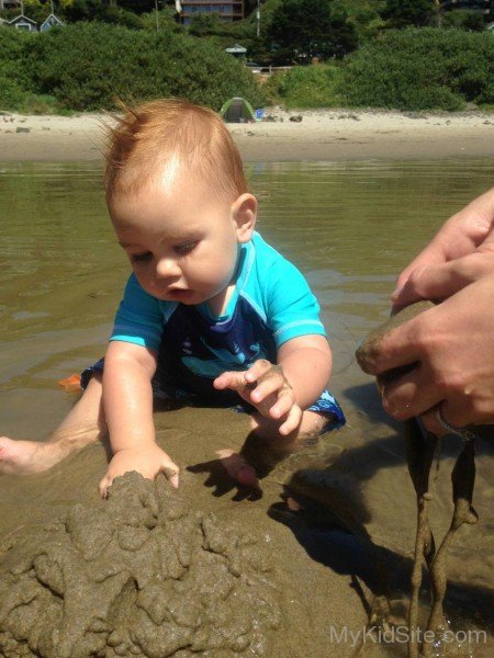 Baby Playing With Mud