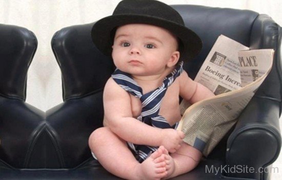 Baby Reading Newspaper