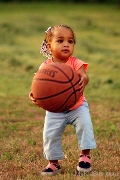 Cute Baby Holding Basketball