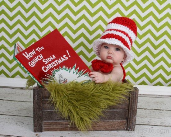 Cute Baby Holding Book