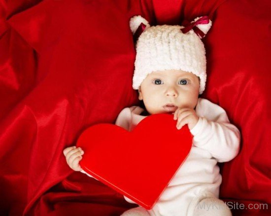 Baby Holding Heart Shape