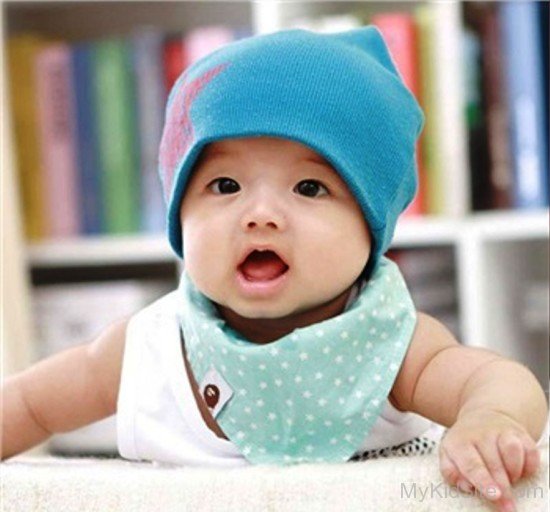 Baby Girl In Blue Cap