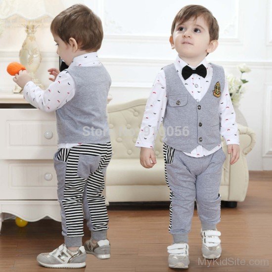 Dashing Boy Wearing Grey Suit