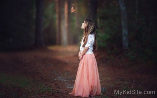 Beautiful Girl Looking At Humming Bird