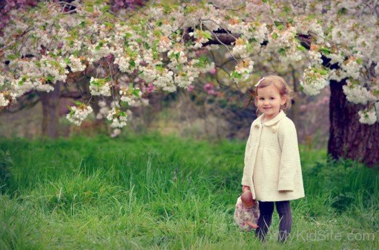 Cute Baby Girl Holding Doll